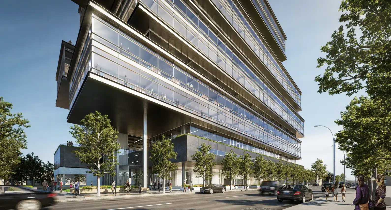 Modern office building with stacked glass floors and a pedestrian-friendly streetscape
