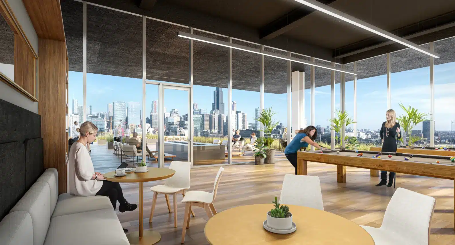 Modern coworking space featuring a social lounge, skyline views, and recreational amenities