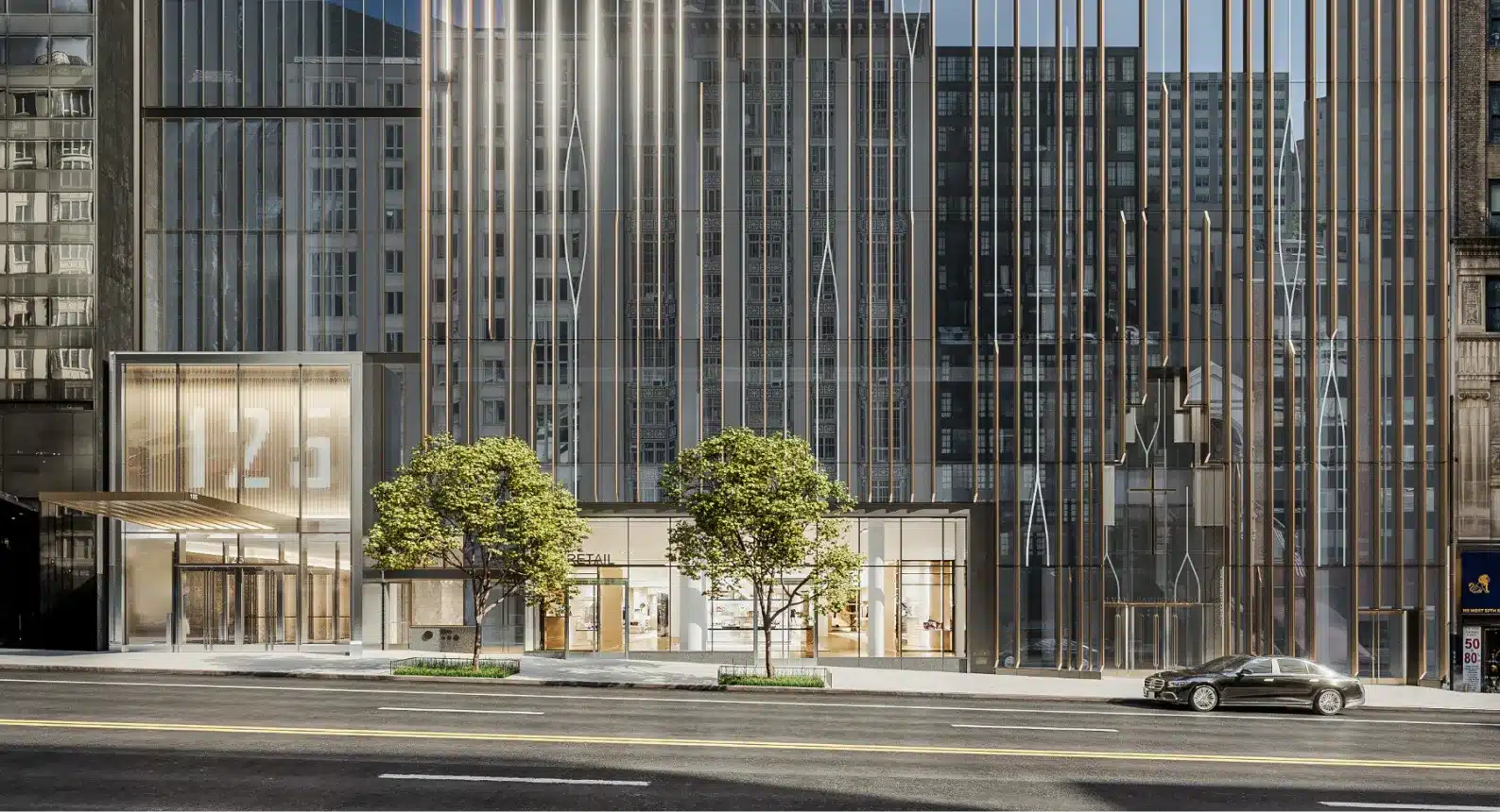 Luxury office building entrance with a modern glass facade and gold-accented vertical lines