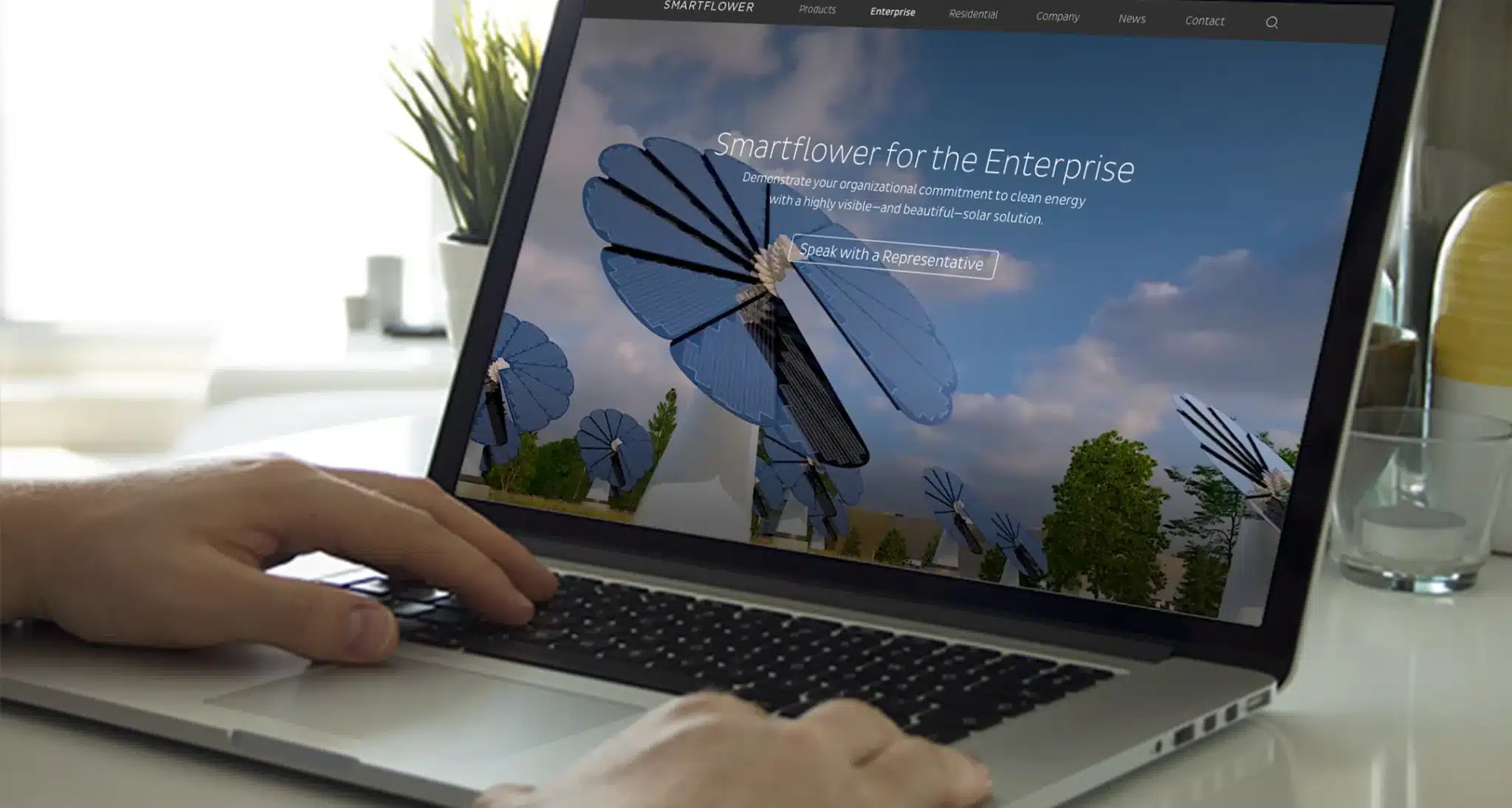 Laptop screen displaying Smartflower solar technology with interactive website interface for enterprises