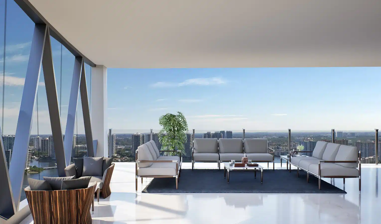 Luxury penthouse terrace with ocean views, modern lounge chairs, and a built-in outdoor kitchen
