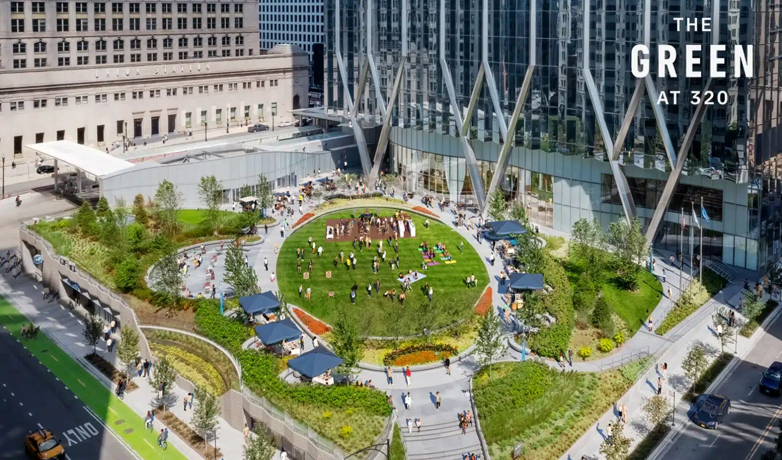 Aerial view of The Green at 320 with crowds enjoying sunny day in circular city park