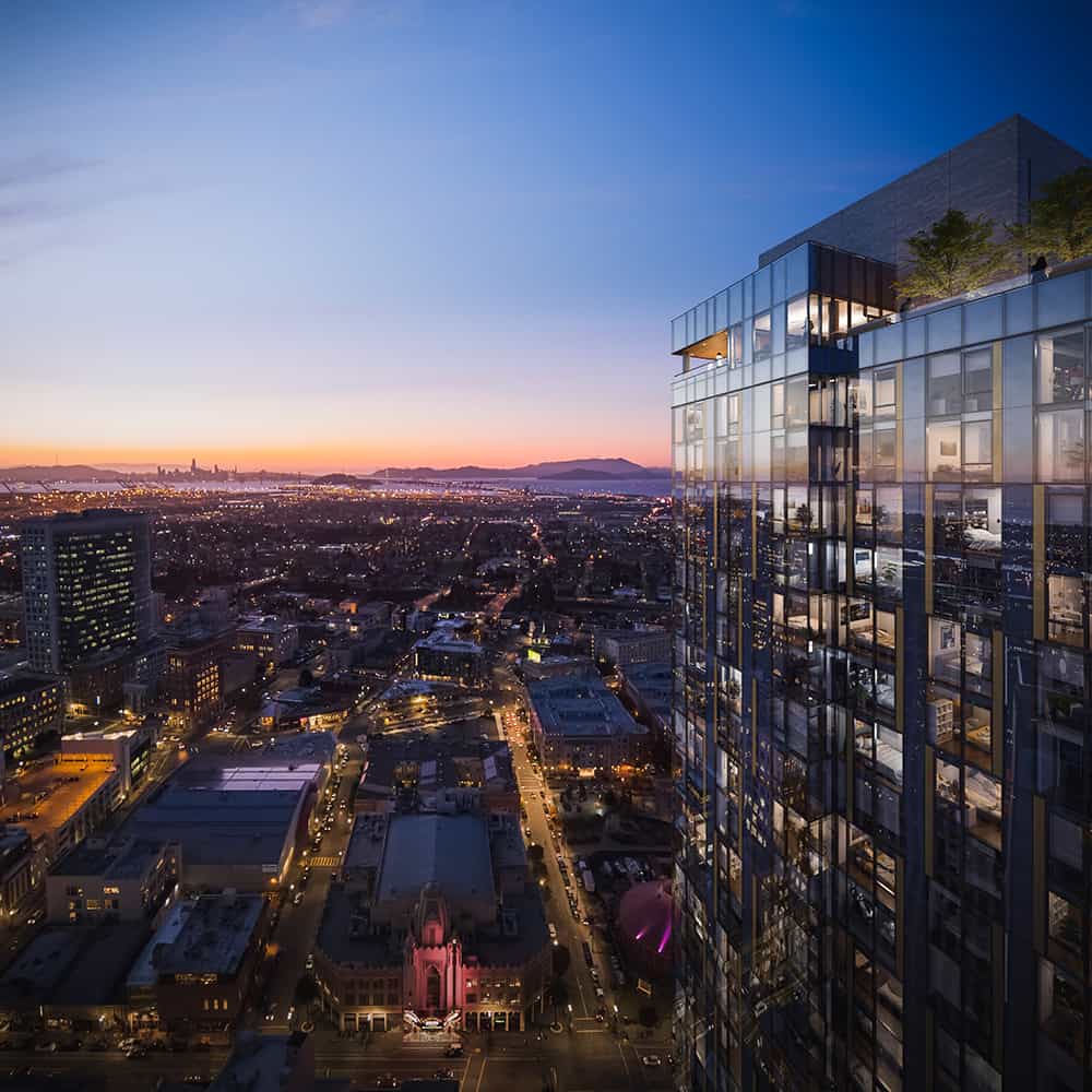 Urban skyline featuring sunset-lit high-rise with window reflections and expansive downtown landscape